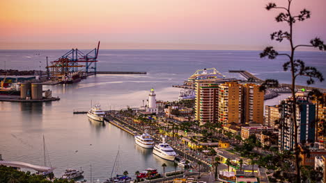 Yachts-at-the-Port-of-Malaga,-Spain-as-seen-from-the-Gibralfaro-Castle-at-sunset---time-lapse