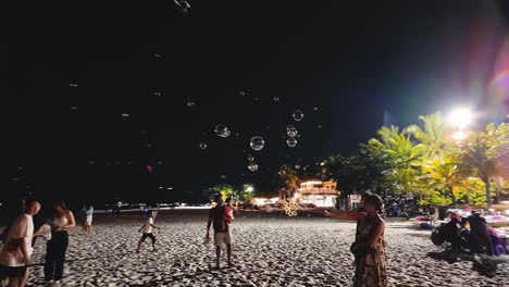 people-joyfully-experiencing-the-serene-beauty-of-Langkawi's-Pantai-Cenang-beach-at-night