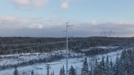 Winter-Forest-Landscape-with-Electrical-Transmission-Lines,-Aerial
