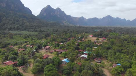 Simple-houses-in-mountain-countryside,-Laos_drone-shot