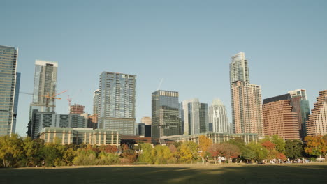 Downtown-Austin-Texas-city-skyline-buildings-at-sunset-with-Auditorium-Shores-park-in-the-foreground