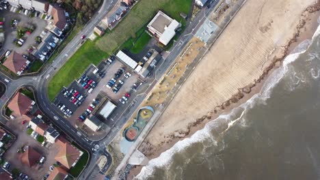 Aerial-shot-of-waves-crashing-against-Roker-Beach