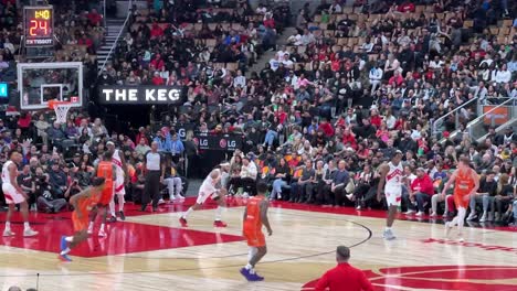 slow-motion-clip-of-basketball-player-scores-at-the-game-while-crowd-applauds