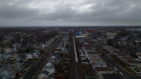 An-aerial-view-of-a-Long-Island-railroad-train-traveling-on-a-cloudy-day