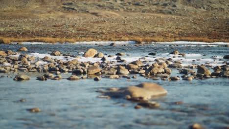 Rocks-in-a-cold-river-in-the-Canadian-tundra