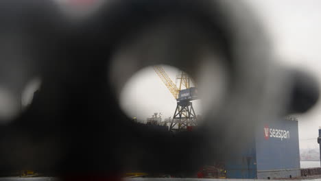 A-point-of-view-shot,-peering-through-playground-binoculars,-fixated-on-Seaspan's-Vancouver-Drydock