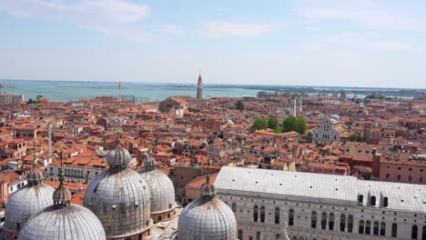 Panning-left-shot-from-Campanile-in-Piazza-San-Marco-over-red-roofs-of-Venice