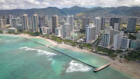 Honolulu-Hawaii-Oahu-Waikiki-Beach-with-tourists-on-wonderful-beach-with-water-and-sand