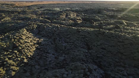 Fast-aerial-orbit-around-Eldhraun-lava-fields-in-Iceland-with-sunset