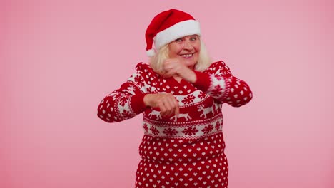Mature-Christmas-grandmother-woman-dancing-trendy-dance-for-social-media-fooling-around-having-fun