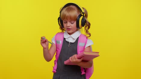 Schoolgirl-listening-music-via-headphones,-dancing-disco-fooling-around-having-fun-gesticulating