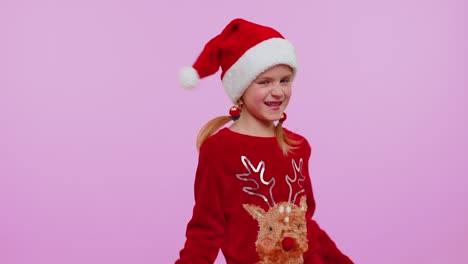Girl-in-Christmas-Santa-sweater,-hat-dancing-trendy-dance-for-social-media-fooling-around-having-fun