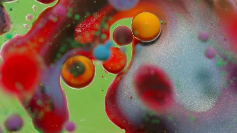 Bubbles-float-in-liquid-paint,-mixing-ink,-oil-and-milk,-abstract-multicolor-hypnotic-painting