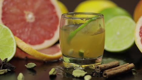 Lime-slice-falls-into-a-glass-cup-with-an-alcoholic-cocktail
