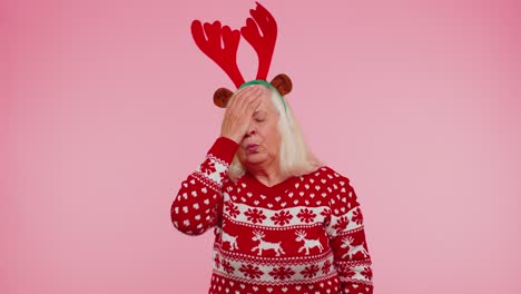 Upset-senior-Christmas-old-woman-making-face-palm-gesture,-feeling-bored,-disappointed,-bad-result