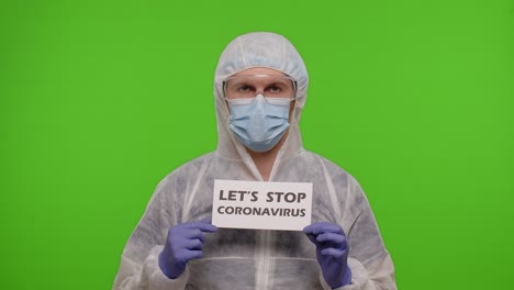 Porträt-Eines-Arztes-Im-PSA-Anzug-Mit-Dem-Slogan-„Lasst-Uns-Das-Coronavirus-Stoppen“-Auf-Papier