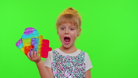 Children-girl-kid-holding-squeezing-anti-stress-touch-screen-push-pop-it-popular-toy-on-chroma-key