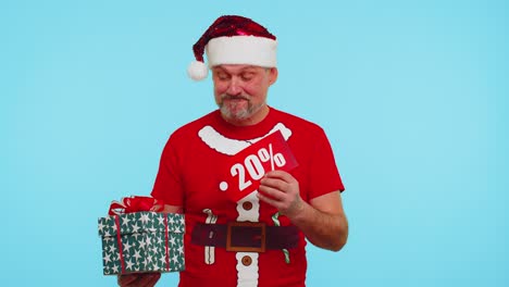 Man-in-red-Christmas-t-shirt-showing-gift-box-and-20-Percent-discount-inscriptions-banner-text-note