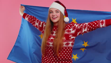 Christmas-Girl-waving-European-Union-flag,-smiling,-cheering-democratic-human-rights-Europe-freedoms
