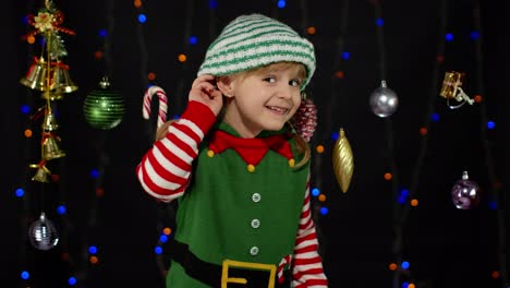 Girl-in-Christmas-costume-keeps-hand-near-ear-tries-to-overhear-what-present-parents-going-to-give