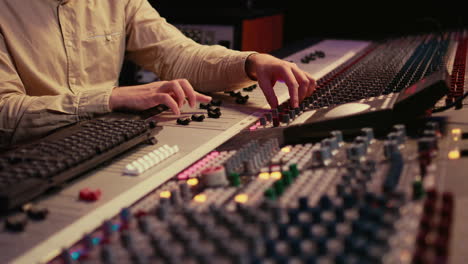 Sound-designer-manipulating-sound-effects-to-enhance-tunes-on-audio-recordings