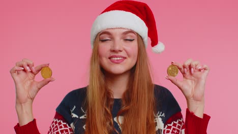 Girl-in-Christmas-sweater-showing-golden-bitcoins-BTC-cryptocurrency-money-investment,-mining-future
