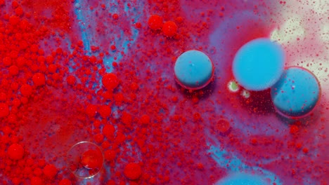 Bright-neon-colorful-bubbles-oil-and-ink,-acrylic-paint-moving-close-up,-wallpaper-background