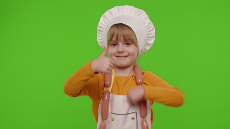 Child-girl-kid-dressed-as-cook-chef-showing-thumbs-up,-smiling,-looking-at-camera-on-chroma-key