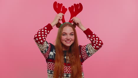 Young-adult-girl-in-Christmas-deer-antlers-listening-music,-dancing-disco-fooling-around-having-fun