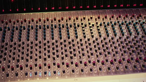 Empty-professional-studio-with-control-desk-mixer-and-pre-amp-knobs