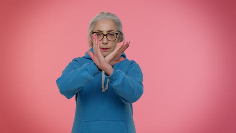 Elderly-granny-gray-haired-woman-say-no-stop-gesture,-warning-of-finish,-prohibited-access-declining