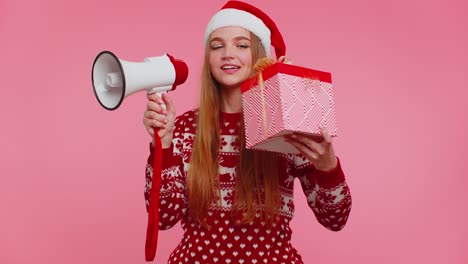 Woman-girl-in-Christmas-sweater-with-gift-box-scream-in-megaphone-announces-discounts-sale-shopping