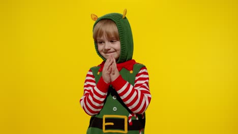 Kid-girl-in-Christmas-elf-Santa-helper-costume-getting,-receiving-present-gift-box.-New-Year-holiday