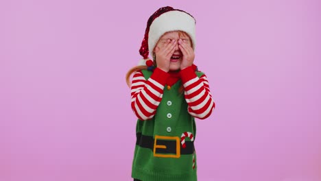 Upset-disappointed-girl-Christmas-Santa-Claus-Elf-wipes-tears,-cries-from-despair-not-received-gift