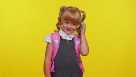 Pupil-schoolgirl-making-mobile-phone-call-to-mother,-discussing-very-pleasant-and-interesting-topic