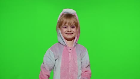 Little-child-girl-smiling,-showing-ok-gesture,-agree-sign-in-unicorn-pajama-on-chroma-key-background