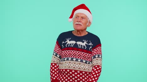 Grandfather-man-in-sweater-Santa-Christmas-getting-present-gift-box,-expressing-amazement-happiness