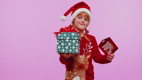 Kleinkind-Mädchen-In-Weihnachtsmütze-Zeigt-Geschenkbox-Und-10-Prozent-Rabatt-Inschriften-Banner-Text-Hinweis