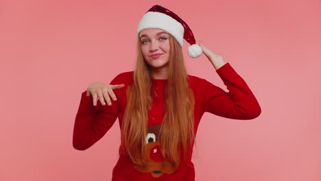 Crazy-girl-in-Christmas-Santa-sweater-hat-demonstrating-tongue-out-fooling-around-making-silly-faces