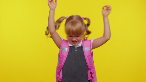 Trendy-school-girl-having-fun-dancing-and-moving-to-rhythm,-dabbing-raising-hands,-dubdance-gesture