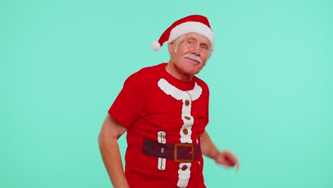 Mature-Christmas-grandfather-man-dancing-trendy-dance-for-social-media-fooling-around-having-fun