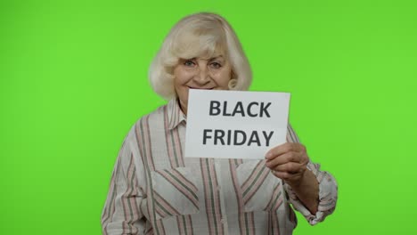 Senior-grandmother-showing-Black-Friday-and-20-Percent-Off-discount-advertisement-inscriptions