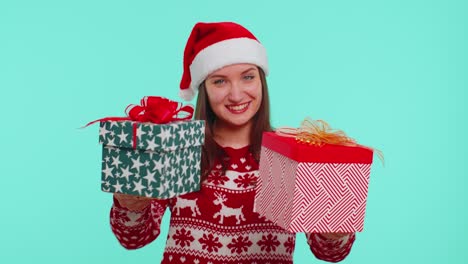 Joyful-girl-in-red-Christmas-sweater-presenting-two-Christmas-gift-boxes,-shopping-holiday-sale-eve