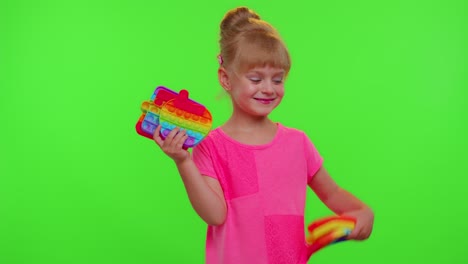 Smiling-child-girl-kid-holding-squeezing-anti-stress-pop-it-touch-screen-toys-simple-dimple-game