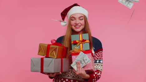 Christmas-Girl-holding-gift-boxes,-concept-of-spending-money,-shopping-online,-cash-dollars-falling