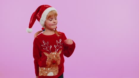 Girl-in-red-New-Year-sweater-deer-showing-thumbs-up-and-pointing-at-on-blank-advertisement-space