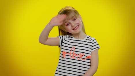 Little-blonde-child-kid-girl-waves-hand-palm-in-hello-gesture-welcomes-someone,-positive-emotions