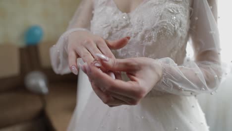 Elegant-blonde-bride-wear-beautiful-engagement-ring.-Woman-at-wedding-morning