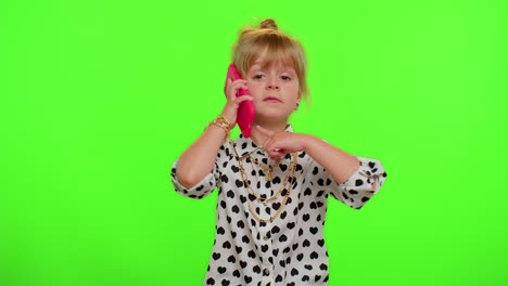 Funny-playful-child-girl-looking-at-camera-doing-phone-gesture-like-says-hey-you-call-me-back
