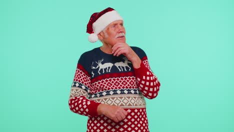Grandfather-in-Christmas-sweater-make-gesture-raises-finger-came-up-with-creative-plan-good-idea